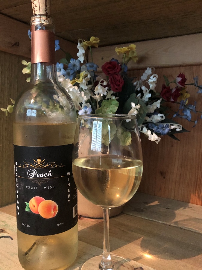Bottle and Glass of Peach Wine