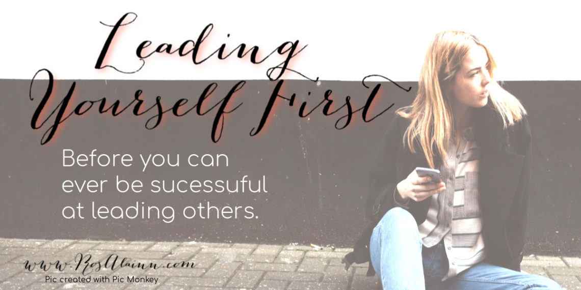 Leading Yourself First Women leaned against wall