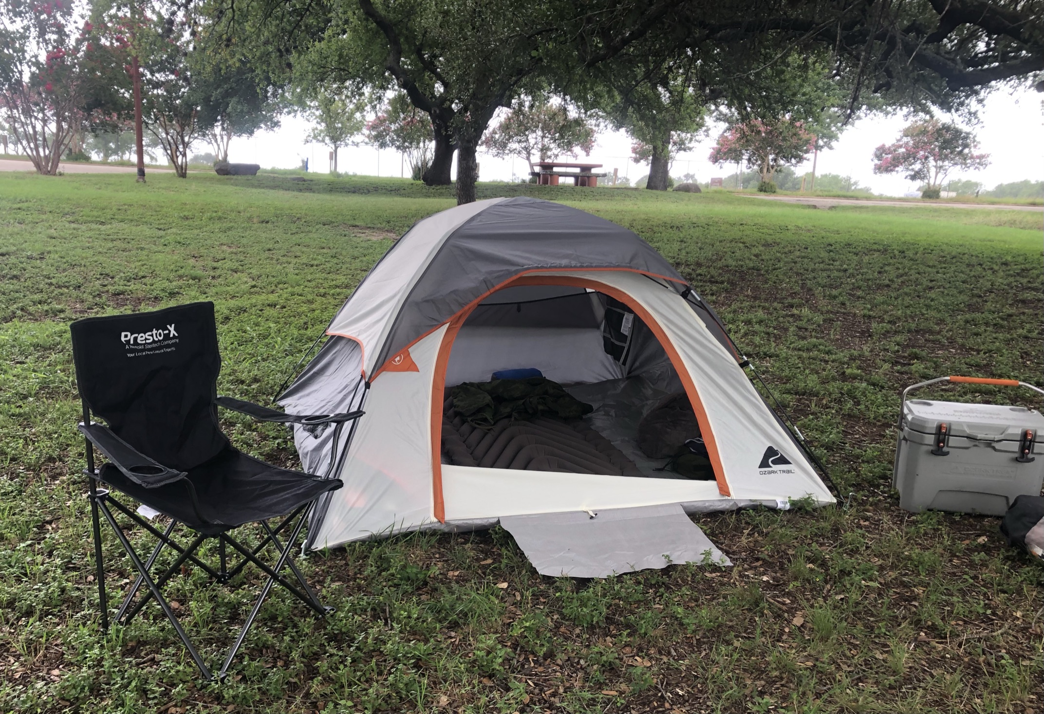grey and orange tent, chair, Robinson Llano County Park